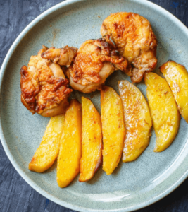 Juicy boneless chicken thighs and crispy potatoes