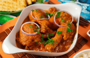 Golden brown chicken pieces simmering in flavorful curry sauce