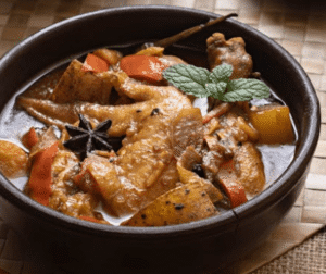 chicken curry served with basmati rice in a bowl